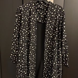 Black trench with white polka dots